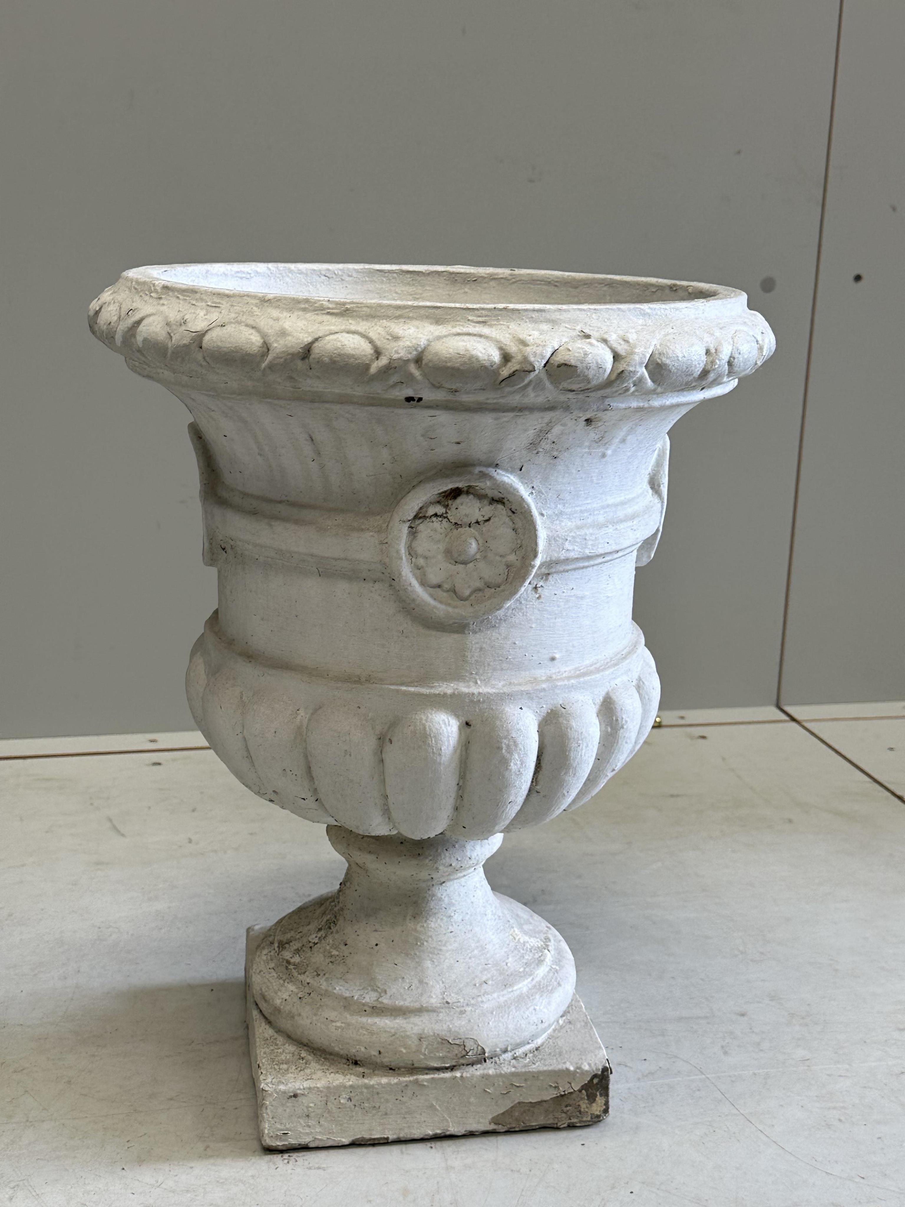 A pair of painted reconstituted stone campana garden urns, diameter 36cm, height 49cm. Condition - poor to fair